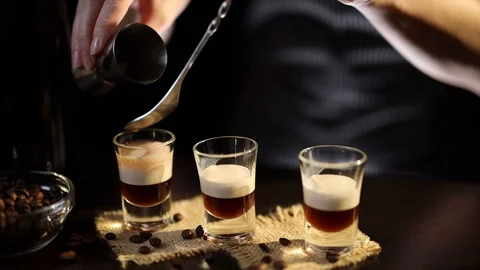Barmaid making B-52 layered cocktail Stock Footage 128736020