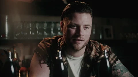 Barman at the bar looking up and blinking Stock Footage 132011694