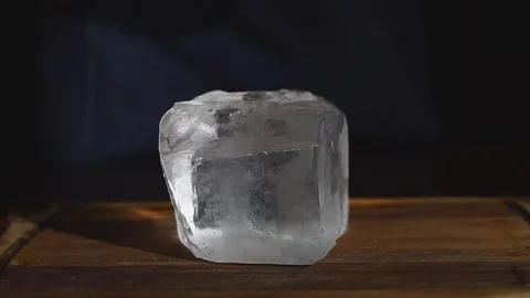Barman chopping ice using a special knife. ?hunks of ice flying around Stock Footage 83786641