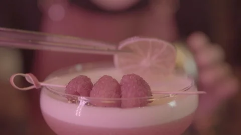 Barman Decorates A Cocktail Glass With A Lime Stock Footage