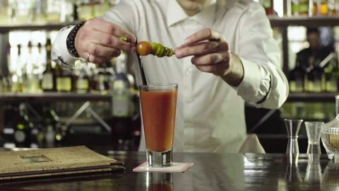 Barman decorates a cocktail with mint close-up slow motion. Stock Footage 76719893
