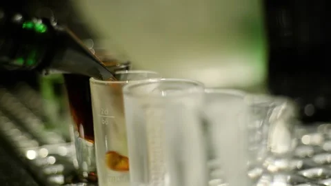 The barman makes a cocktail-shot Stock-Footage 130774699