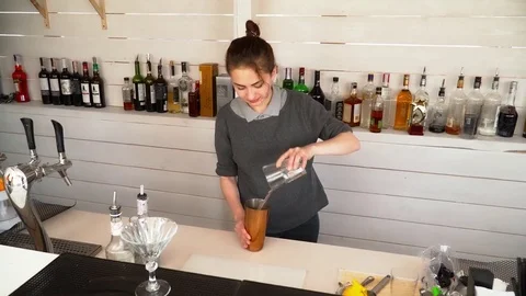 Barman making cocktail on the bar Stock Footage 77025975