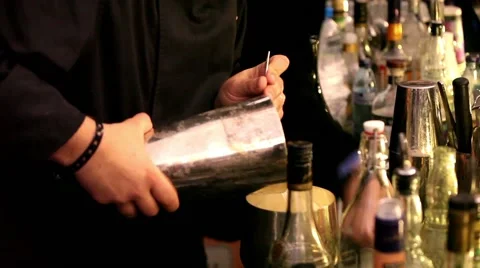 Barman making short drinks in bar Stock Footage 55694329