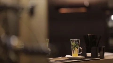 The barman is making tea. Tea with lemon, ginger and mint Stock Footage 82082482