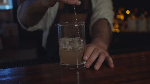 Barman mixing a drink in a bar pub. Stock Footage 114836145