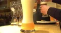 Barman pouring foamy beer into glasses, brewing business, catering service 4k or 4k+ Resolution