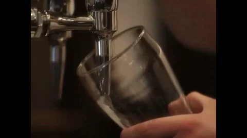 Barman pours beer Stock Footage 98578688
