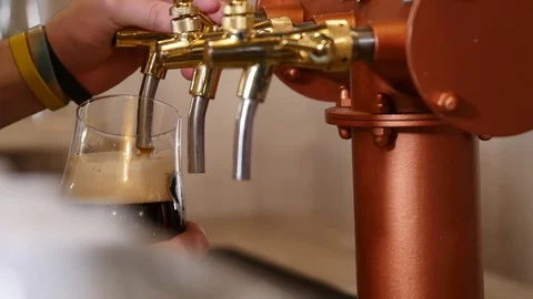 Barman pours beer in pub Stock Footage 82962563