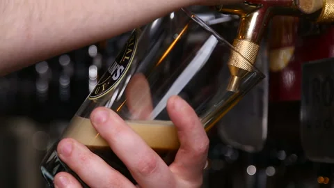 The barman pours a dark beer without gas Stock Footage 91269437
