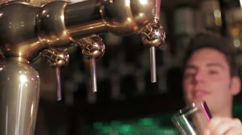 Barman pours pint Stock Footage 22644307
