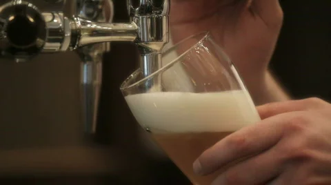 Barman pours pint, HD Stock Footage 500276