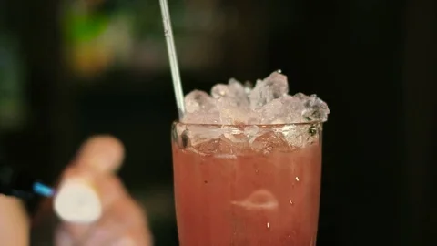 The barman prepares a cocktail and sets it on fire 4k Video stock 74896253