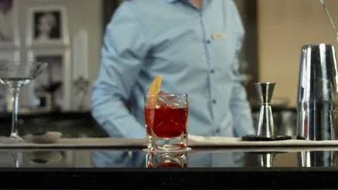 Barman preparing a cocktail in luxury bar interior. close-up Video stock 79709944