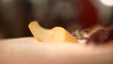 Barman puting spiral orange peel on glass with pink alcoholic drink at fancy bar Stock Footage 117377514