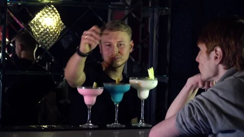 The barman serves a cocktail to the client Video stock 85127084
