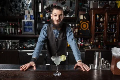 Barman serving cocktail. Stock Photos