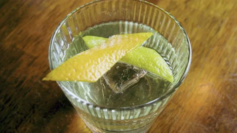 The barman serving a mixed alcoholic drink in a bar. White negroni cocktail. 4K Stock Footage 95203804