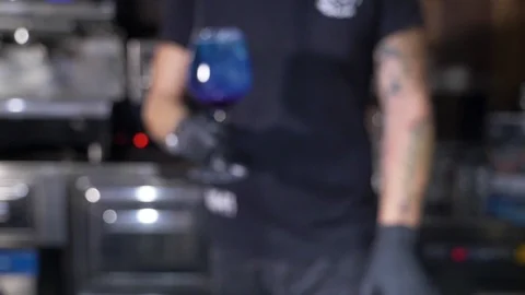 Barman serving refreshing blue cocktail on bar counter. slow motion Stock Footage 101785230