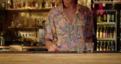Barman serving shots Stock Footage 203898866