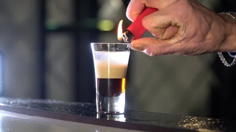 The barman sets the cocktail on fire Stock Footage 85129710