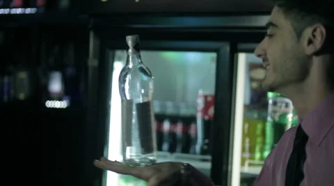 Barman shows trick with a bottle. Stock Footage 56751165
