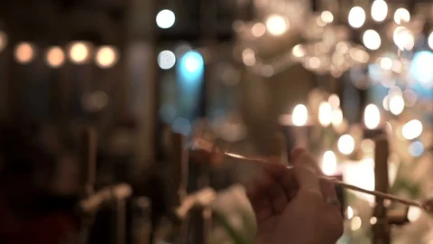 Barman spins chrome long-handled bar spoon for alcohol cocktails at fancy bistro Stockbeeldmateriaal 117377556