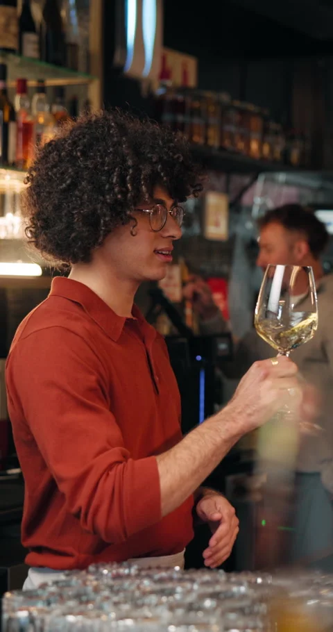Barman, wine tasting and guide with smell at restaurant for vintage, flavor Stock Footage 329390624