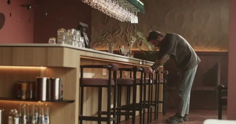 Barman wiping counter while preparing bar for opening Video stock 239168774