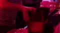 Barman working, pouring, serving alcohol drinks to bar guests HD Footage