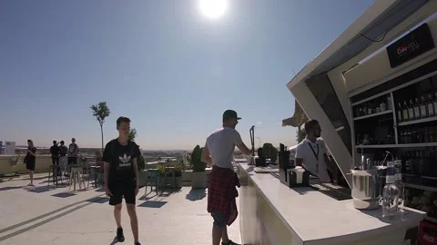 Barman Working Serving Customers on Open Air in Sunny Day, Roof Bar, Madrid Stock Footage 86877892