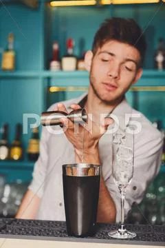 Barman's hands making shot cocktail Stock Photos