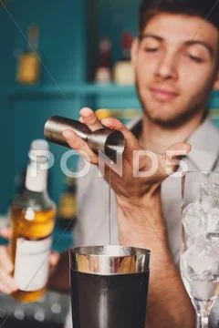 Barman's hands making shot cocktail Stock Photos