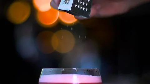 The barman's making a cocktail at the bar. Stock Footage 130780565