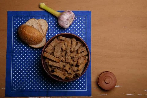 Barn bread on blue polka dot napkin, bowl of rye dried bread or crackers Stock Photos