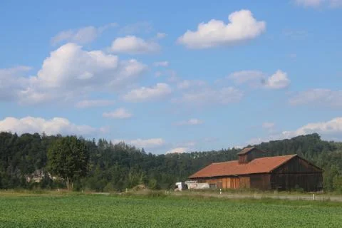 Barn with clouds in the sky Stock Photos