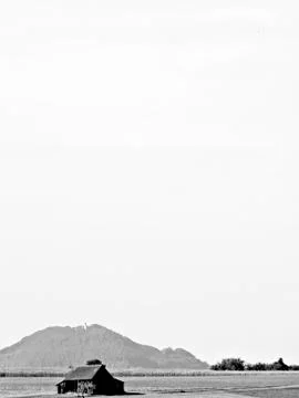 Barn with a hill in the background Stock Photos