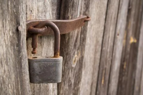 Barn lock on the barn door. Rusty iron Stock Photos