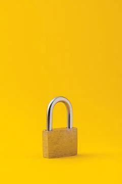 Barn lock on a yellow background Stock Photos