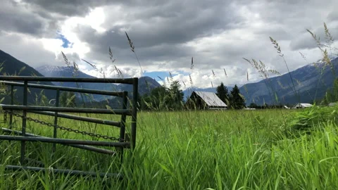 Barn in mountain valley field Stock Footage 146989285