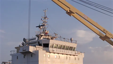 Barnacle bulk carrier cargo ship command bridge mooring in the port of Stock Footage 345525049