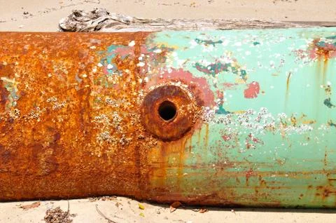 Barnacle covered rusty pipe Stock Photos