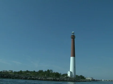 BARNEGAT LIGHT LIGHTHOUSE FROM THE WATER IN SLOW MOTION Stock Footage 76584807