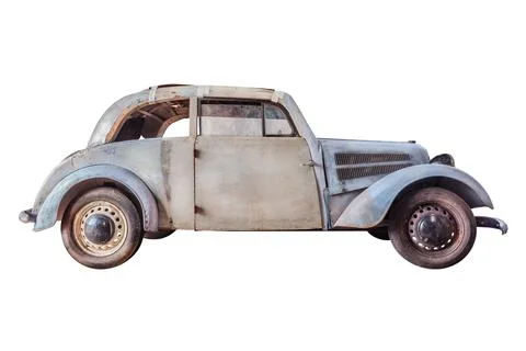 Barnfind of a wrecked oldtimer car with broken wooden parts isolated on a w.. Stock Photos