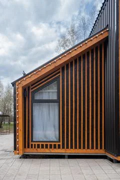 Barnhouse facade element. Bright stylish home. panoramic window. Blue sky Stock Photos