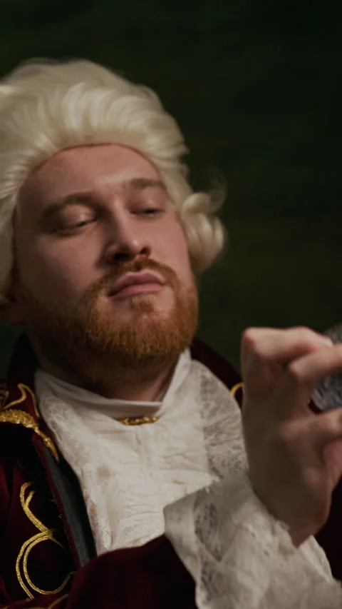 Baroque Aristocrat in Wig Spraying Perfume from Bulb Atomizer Indoors Vidéo 333572679