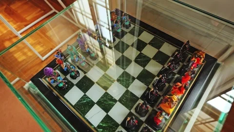 Baroque Chess Set Displayed In Glass Case, Soft Reflections From Palace Windows Video stock 323341974