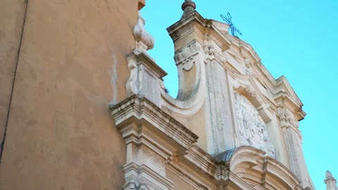 Baroque church clock tower downward pan Stock Footage 330534859