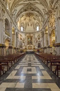 Baroque church interior with ornate altar and vaulted ceiling Stock Photos