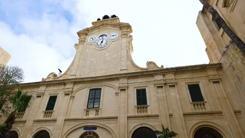Baroque clock tower grand master's palace valletta curved pediment limestone Stock Footage 341772405
